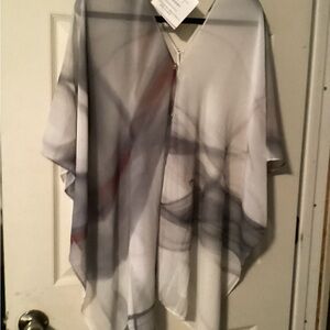 Extremely versatile top in soft dove grays, never worn.